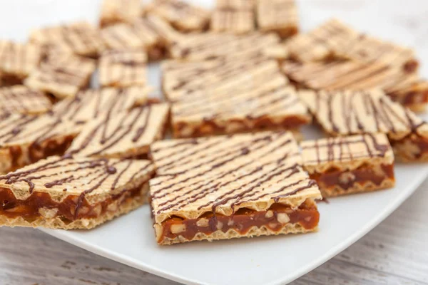Crisp waffle wafer biscuits with caramel and walnut — Stock Photo, Image