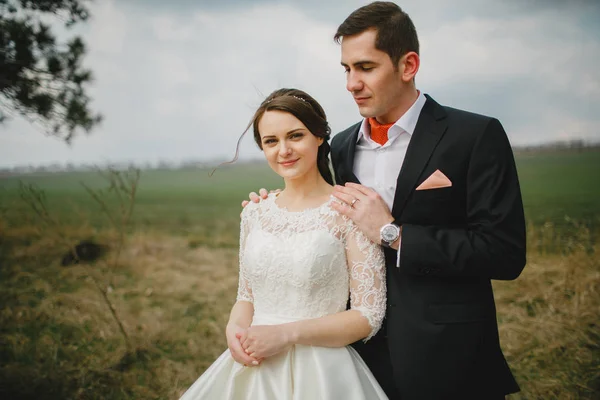 Groom with the bride on a walk — Stock Photo, Image