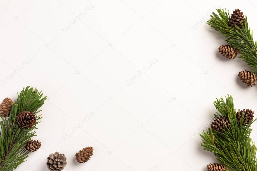 Christmas composition. Spruce branches with cones, on a white background. Christmas, winter, new year concept. Flat lay, top view, copy space.