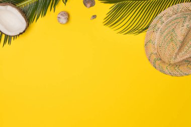 Summer composition with beach accessories, on yellow background. Top view, copy space. Flat lay.