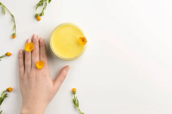 Organic Cosmetic Concept Flowers Calendula Female Hand Cosmetic Cream Isolated — Stock Photo, Image