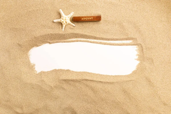 Sand on white background. Summer background with copy space and frame for text. Top view.