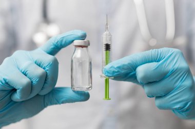 Syringe, medical injection in hand. Vaccination equipment with needle.