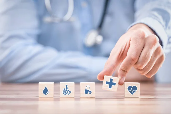 Hand Arranging Wood Block Healthcare Medical Icon Health Insurance Concept — Stockfoto