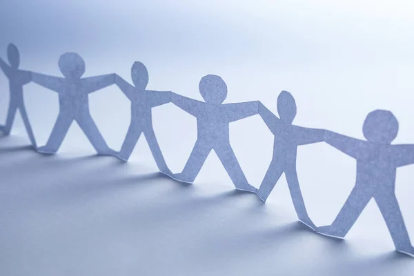 Team Von Papierkettenleuten Menschenkette Mit Licht Und Schatten Blauer Hintergrund Stockbild