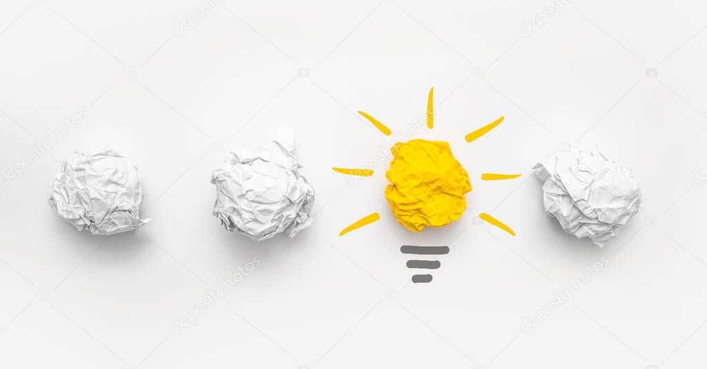 Creative new idea. Innovation, brainstorming, inspiration and solution concepts. Light bulb with crumpled paper on white background.