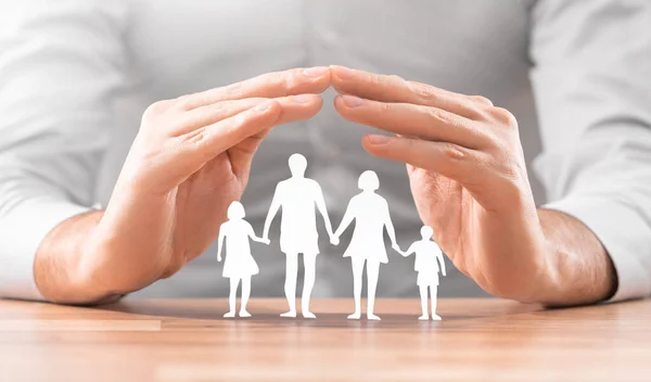 Hands Cut Out Paper Silhouette Table Family Care Concept Royalty Free Stock Images