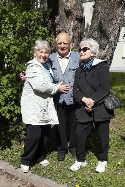 Group of happy elderly people relaxing and enjoying life