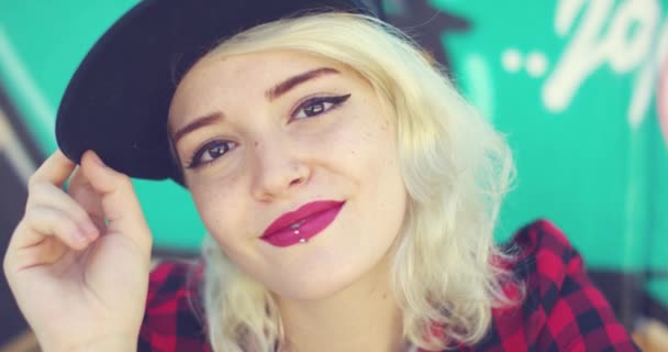 Gorgeous young blond woman with a pierced lip — Stock video