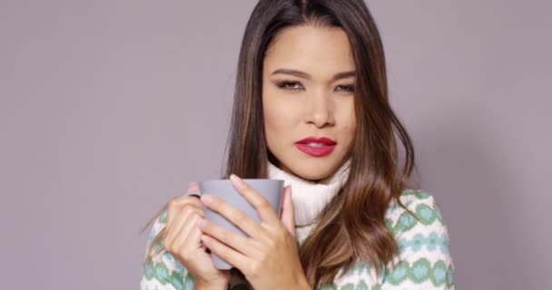 Attractive woman enjoying a hot beverage — Stock Video