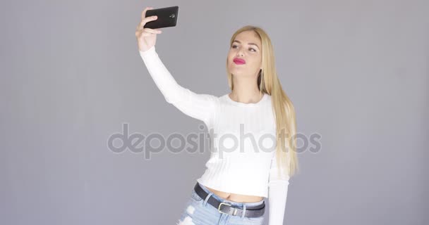 Fun sexy young woman posing for a selfie — Stock Video