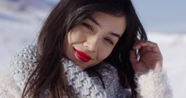 Beautiful young woman in snowy landscape — Stock Video