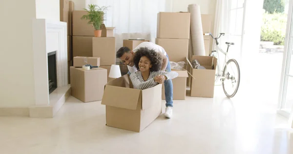 Fun young woman inside a packing box