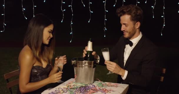 Man fills his glass with champagne to toast — Stock Video