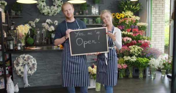 Florists posing with tablet — Stock Video