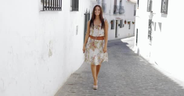 Excited young girl walking in sunny street — Stock Video