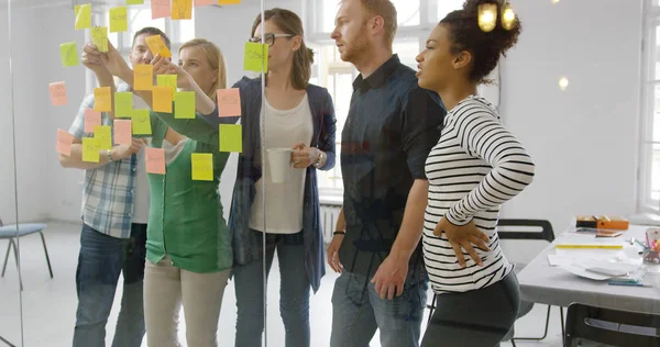 Young people working together in office — Stock Photo, Image