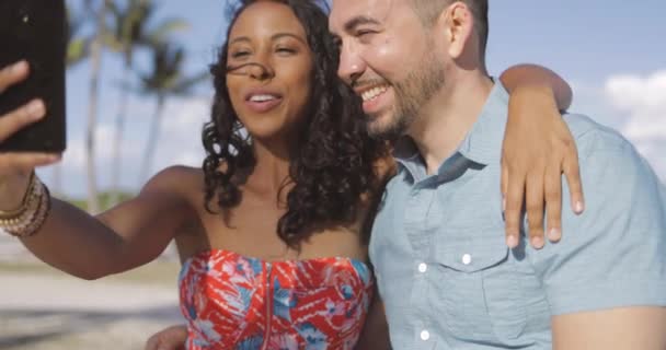 Diverse bright couple taking selfie — Stock Video