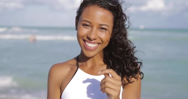 Laughing black woman in swimsuit on beach Video Clip