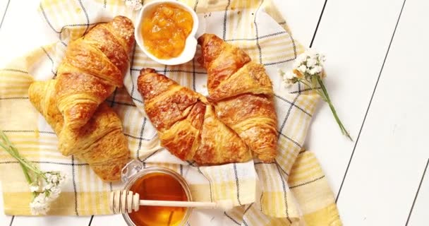Croissants and condiments composition on the table — Stock Video