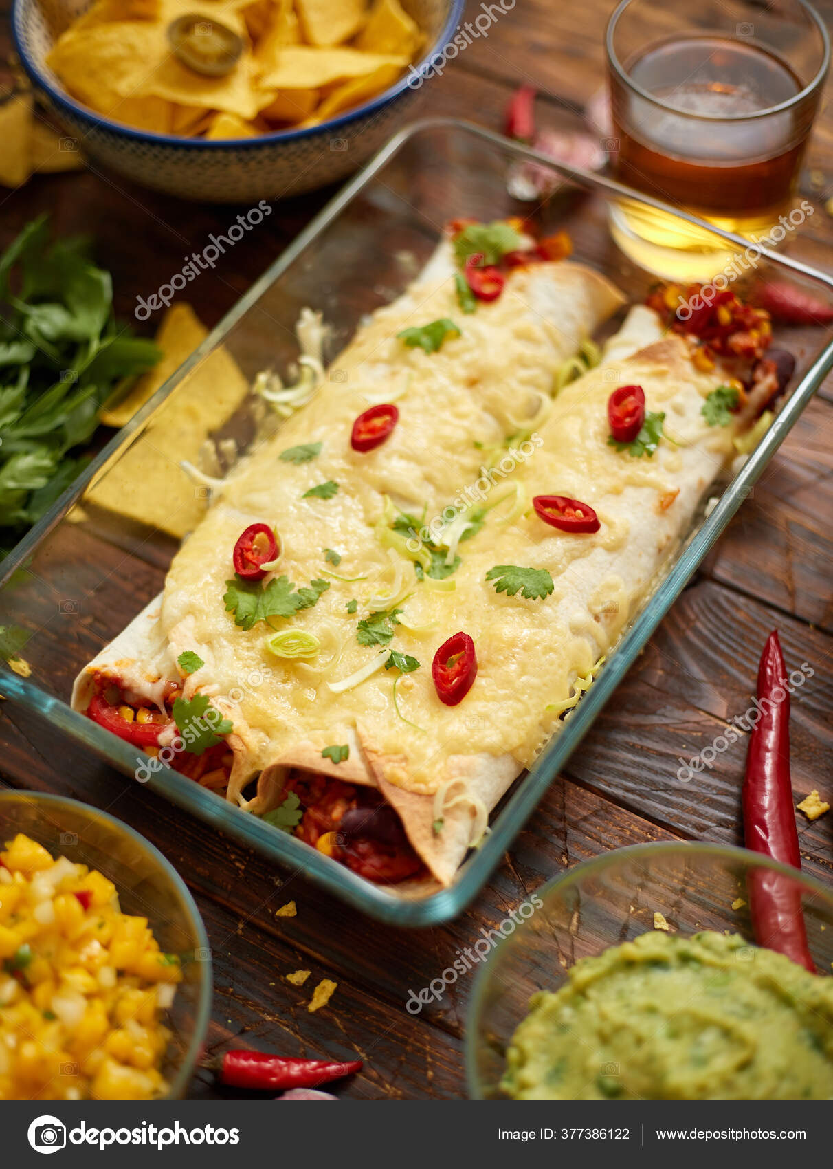 Vegetable Burritos served in glass heatproof dish. With salsa