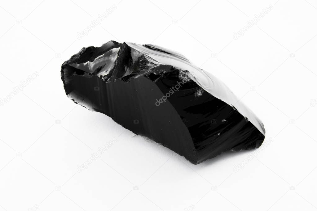 extreme close up of Obsidian mineral isolated over white background