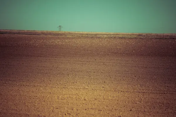 Paisagem com campo arado — Fotografia de Stock