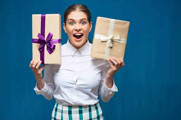 Surprised business woman holding gift boxes.