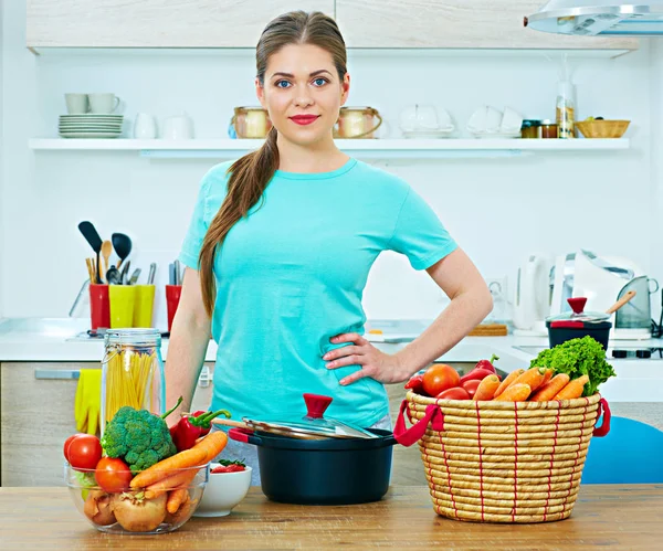 Happy woman cooking food at home. — Stock Photo, Image