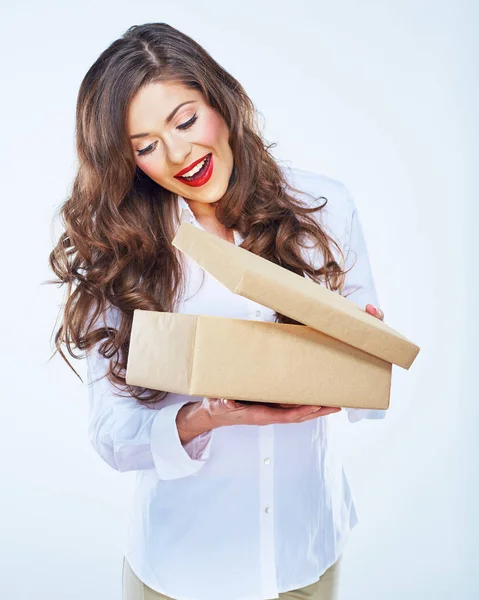 Young woman looking into open box. Long curly hair — Stock Photo, Image