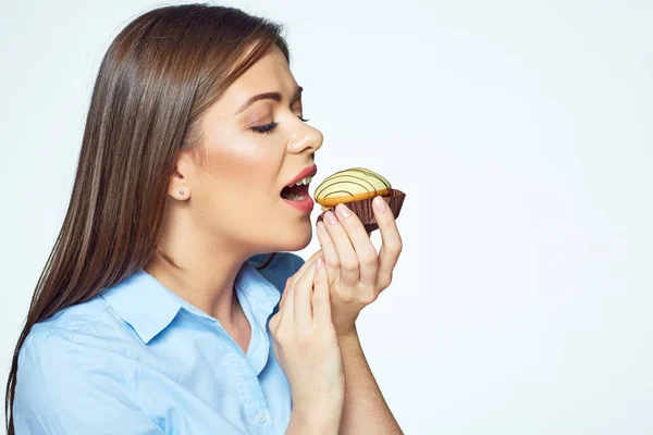 Young woman biting french cookie. Close up face portrait — Stock Photo, Image