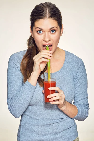 Funny young woman drink red juice. — Stock Photo, Image