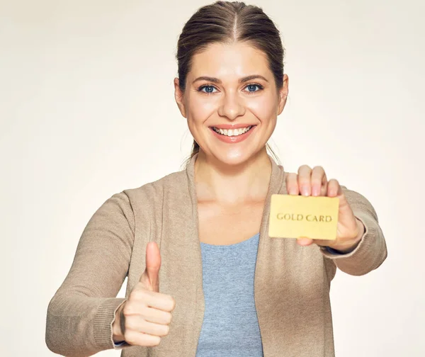 Young woman holding credit card shows thumb up. — Stock Photo, Image