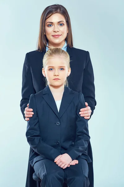 Businesswoman hugging little daughter — Stock Photo, Image