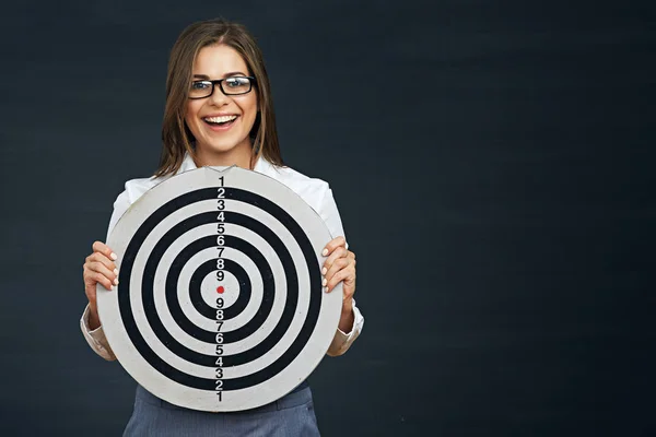 Businesswoman holding black white target — Stock Photo, Image