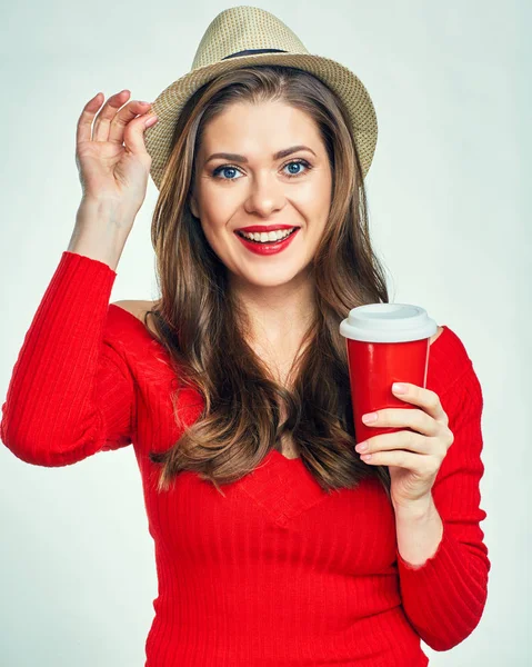 Woman holding red coffee cup — Stock Photo, Image