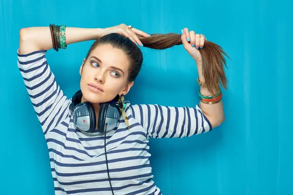 Woman with headphones on neck — Stock Photo, Image