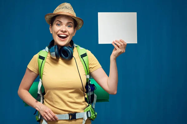 smiling woman with tourist backpack