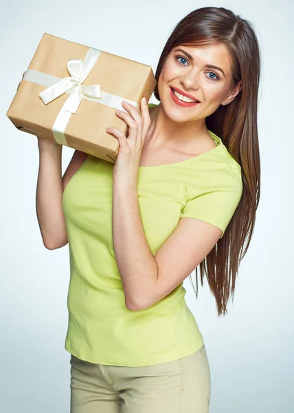 Smmiling woman holding gift box with white stripes. — Stock Photo, Image