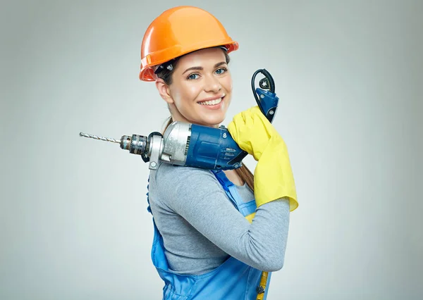 Woman builder holding drill tool. — Stock Photo, Image
