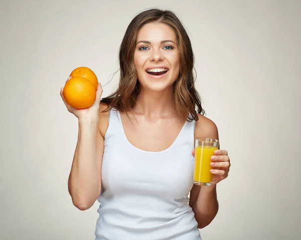 Smiling woman with orange fruit and juice isolated portrait. — Stock Photo, Image