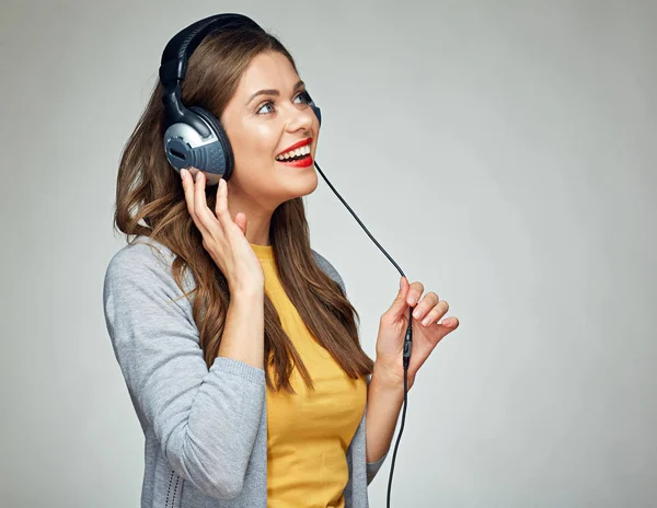 Listening music young smiling woman isolated — Stock Photo, Image