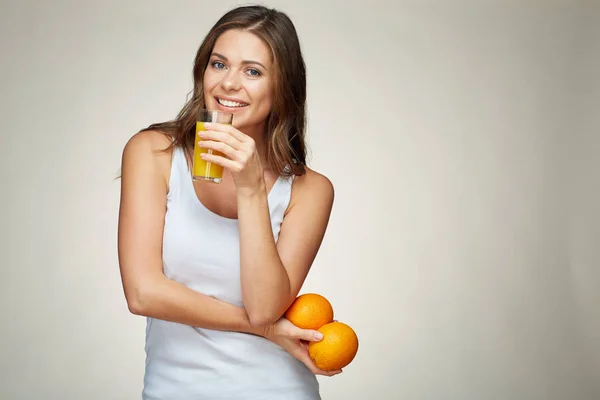 Woman holds fruit and juice. vitamin drink. — Stock Photo, Image