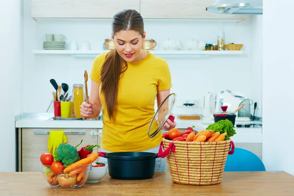Happy woman cooking food at home. — Stock Photo, Image