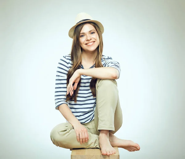 Smiling girl sitting on chair. — Stock Photo, Image