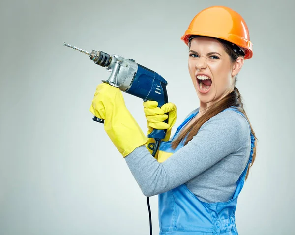 Hard work of woman builder with drill tool. — Stock Photo, Image