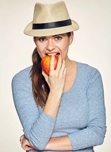 Happy woman biting red apple — Stock Photo, Image