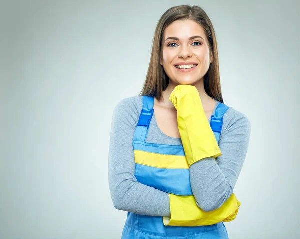 Thinking cleaner woman in coveralls — Stock Photo, Image