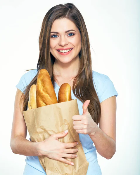 Woman holding paper bag with bread — Stock Photo, Image