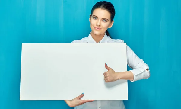 Young business woman holding sign board shows thumb — Stock Photo, Image